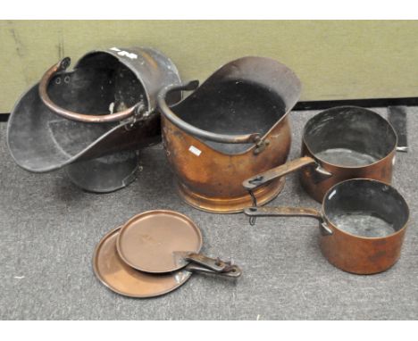 Two vintage copper coal scuttles and various mixed metal pans