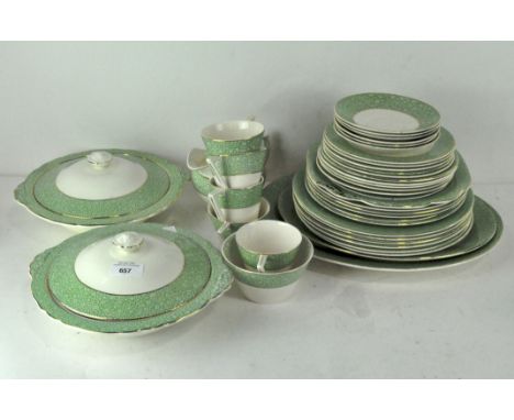 A vintage part Wedgwood 'Garden' gilt dinner service decorated with a band of green moss-like pattern