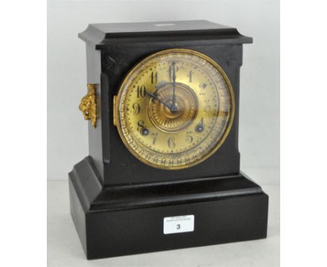 An American mantel clock, the gilt dial on an Ansonia movement striking to a gong, the black case with gilt mounts, height 27