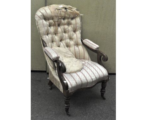 A Victorian button back armchair with scroll arms and turned legs on casters, upholstered in pale pink and cream, height 100 