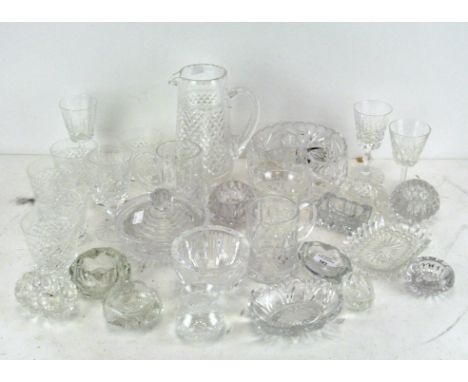 A large selection of vintage and contemporary cut glassware including glasses, dishes, bowls and a large jug