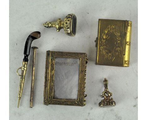 A collection of 19th Century gilt metal items, comprising a French gilt metal and mother of pearl rectangular notebook, engra