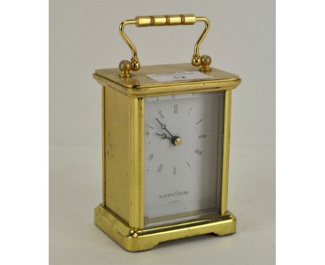 A Mappin &amp; Webb brass carriage clock, 20th century, of traditional form, with bevelled glass front and quartz movement, 1