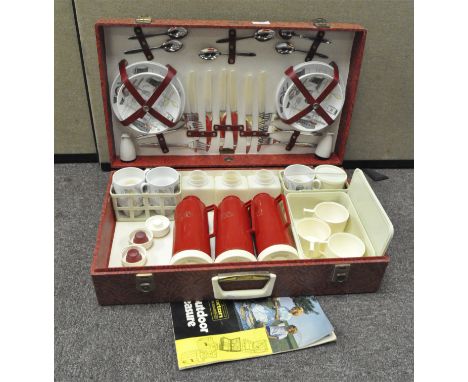 A vintage retro picnic set, the ceramics marked 'Fiesta' by Barker Bros., with three red thermos, cutlery and other items all