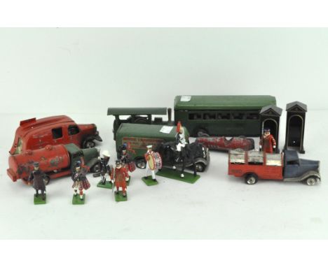 A Triang Minic truck, a clockwork steam tractor, a Minic Transport Express Service truck, a Green Line bus, a clockwork Fire 