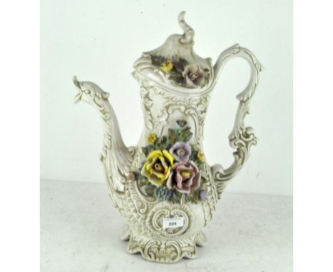 A large vintage cream-glazed Capodimonte jug with dragon spout and flowers in relief, height 46cm