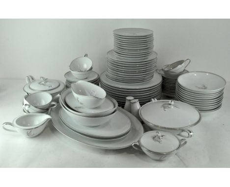 A large Noritake 'Candice' pattern dinner service, printed with leafy branches within platinum borders, including: serving di