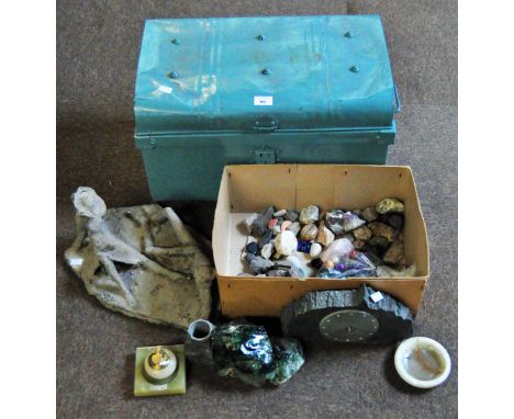 A vintage turquoise painted metal trunk containing a modern sculpture and a large number of various stones