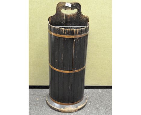A vintage umbrella stand, formed as a copper-mounted barrel, height 79cm