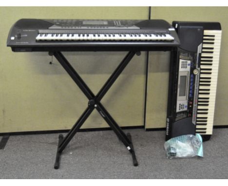 Two electric keyboards with a stand, comprising: a Casio CTK-811EX, and a Yamaha PSR-540, instructions for the second, with a
