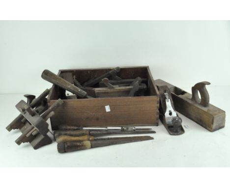 A collection of vintage handwork and woodwork tools, including chisels and screwdrivers