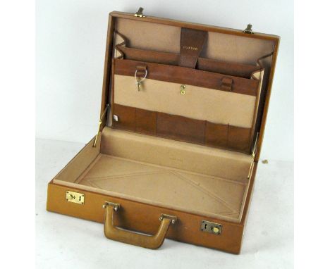 A vintage 1960's leather briefcase, (with keys), label to interior states "made in Romania" 45 cm wide 