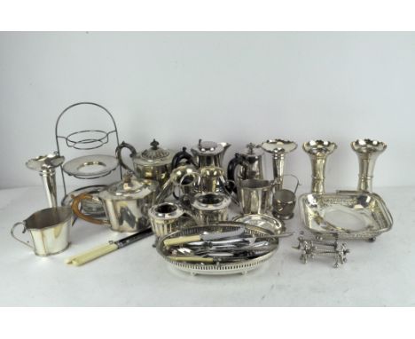 A large group of vintage and early 20th century silver plate including tea and coffee pots, vases, and some flatware