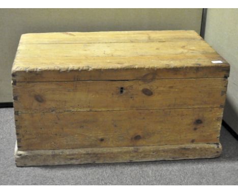 A vintage pine storage trunk, with metal handles to two sides, opening to reveal a two part interior, 40 cm x 83 cm x 48 cm