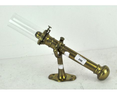 A vintage brass and glass ships gimbal oil lamp, total height including glass when wall mounted 37.5 cm