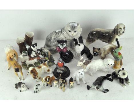 A collection of modern ceramic animals including dogs, cats, a seal, polar bear, and other examples by Coopercraft, and other