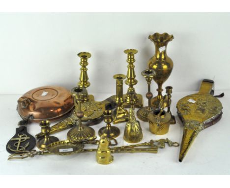 A quantity of vintage brassware including bellows, a bell and candlestick