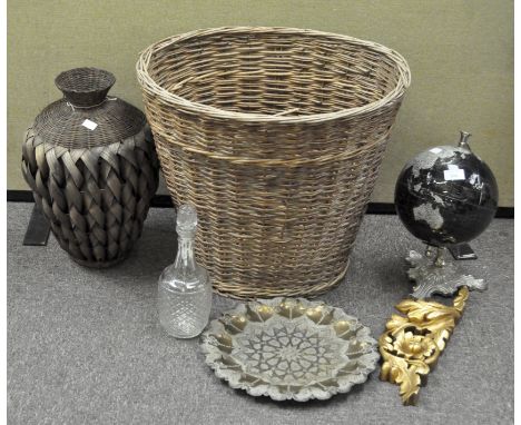 A large wicker basket, height 46cm, containing various collectables including a glass decanter and a spinning globe