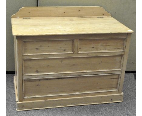 A large pine trunk with gallery back, hinged lid and fixed 'drawer' fronts, 80cm x 104cm x 54cm