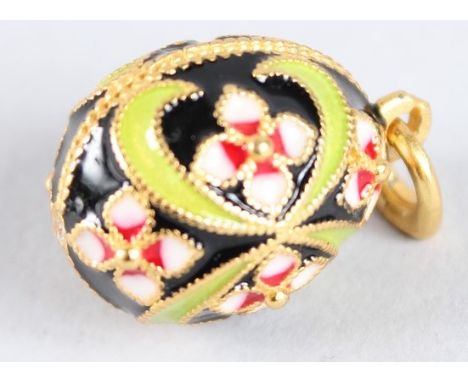 A RUSSIAN SILVER AND ENAMEL EGG PENDANT.