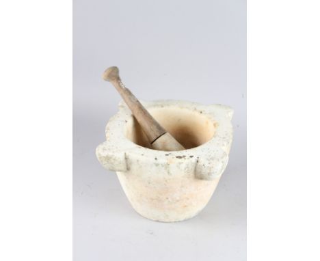 A LARGE MARBLE PESTLE AND MORTAR.