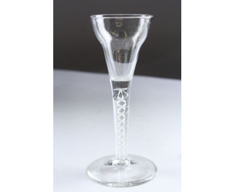 A GEORGIAN WINE GLASS with white air twist stem. 6ins high.