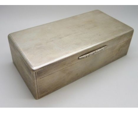 An Asprey London silver cigarette box with engine turned design, London 1937, 17.5 x 9cm, 640g total weight