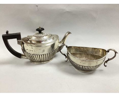 A Hallmarked Silver Tea Pot, (marks rubbed), of oval semi reeded form, initialled; Together with Matching Hallmarked Silver T