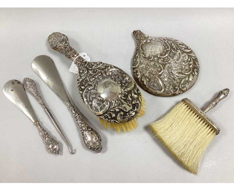 An Assortment of Hallmarked Silver Cased Dressing Table Items, of embossed decoration, to include a bonnet brush, hair brush,