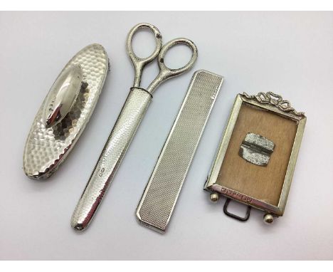 An Antique Hallmarked Mounted Silver Nail Buffer, together with a hallmarked silver comb cover, hallmarked silver handled sci