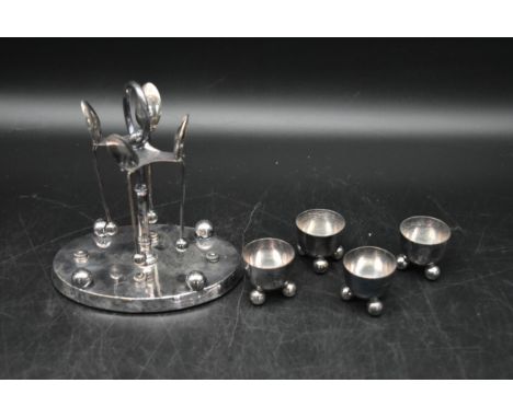 A Victorian silver cruet set, with spoons and stand by Howson Brothers. Includes four cruets with ball feet and circular stan