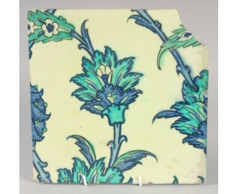 A FINE AND LARGE 16TH-17TH CENTURY OTTOMAN IZNIK OR DAMASCUS TILE, with floral decoration, 25cm square.
