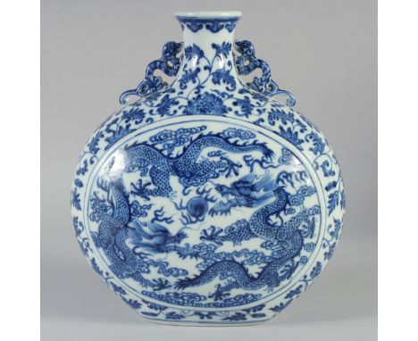 A CHINESE BLUE AND WHITE PORCELAIN MOON FLASK VASE, decorated with dragons and the flaming pearl of wisdom, with moulded chil