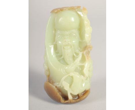 A CHINESE CARVED JADE PEBBLE of Shou Lao, 9cm.