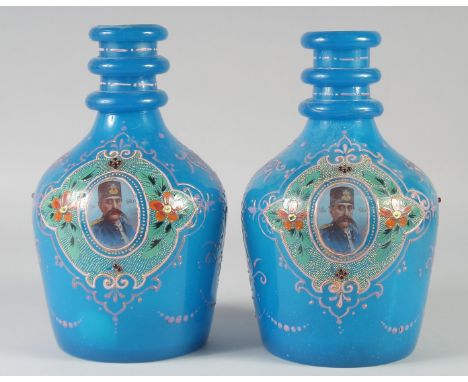 A SUPERB PAIR OF BOHEMIAN GLASS ENAMELLED BOTTLES, with portrait of Muzaffar Aldin Shah, 26cm high.