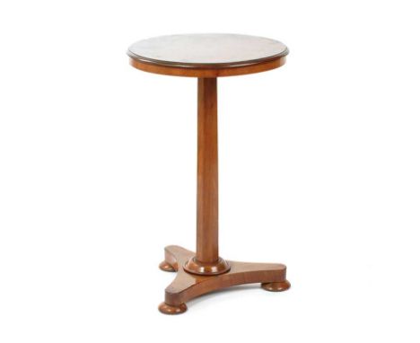 CIRCULAR REGENCY ROSEWOOD LAMP TABLE WITH CENTRAL PILLAR ON FOUR BUN FEETHEIGHT: 30 INCHESDIAMETER: 19 INCHESIN GOOD CONDITIO