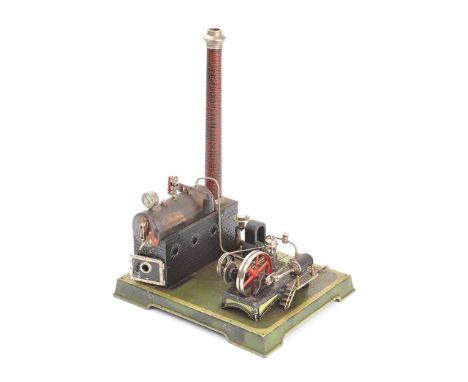 MODEL STEAM ENGINE ON METAL BASEHEIGHT: 16 INCHESWIDTH: 11 INCHESDEPTH: 9 INCHESUNKNOWN IF IN WORKING ORDER