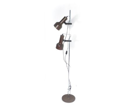 A 1970's twin-spot standard lamp, the brown enamelled shades on an aluminium shaft CONDITION REPORT: Working order unknown an