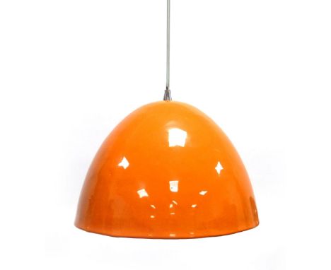 An orange enamelled ceiling lamp with a cream interior