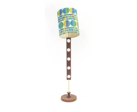 A 1960's teak standard lamp with a geometric shade CONDITION REPORT: Requires re-wiring, brass clip for shade wonky
