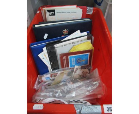 An Accumulation of World Stamps, loose on and off paper in bags, albums (4), stockbook (1). Also includes an empty stockbook,