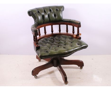 Mahogany and green leatherette Chesterfield style button detail captain's swivel chair, H 85cm
