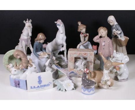 Assortment of Lladro and Nao figurines to include a unicorn, bisque finish unicorn, butterfly, bunnies, donkey with flower, s