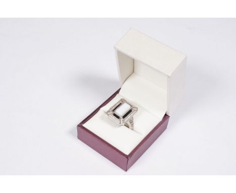 A sterling silver Art Deco style ring set with central opal. 