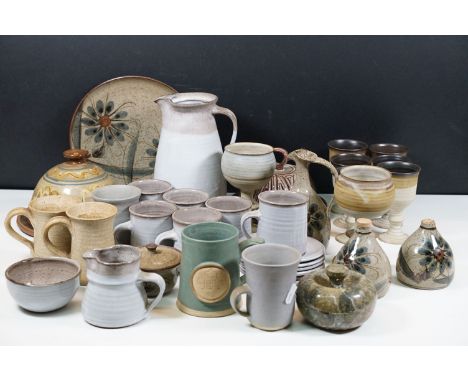 Assorted studio pottery pieces to include two Wilsker cups together with wine goblets, cups and saucers, cheese domes, jugs, 