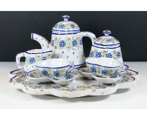 Hand painted floral tea set on scalloped edge raised tray to include tea pot, two trefoil shape tea cups and saucers, sugar p