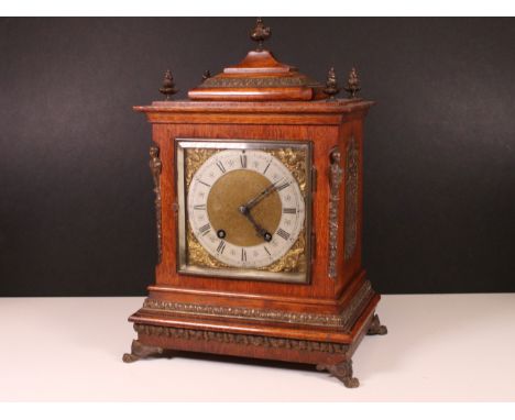 Lenz Kirch wooden cased mantle clock with metal detail and decorative finials raised on lions feet 