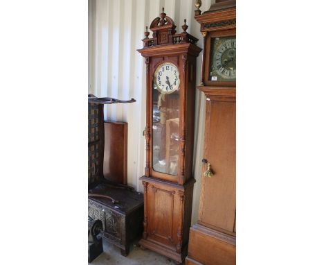 Early 20th century oak longcase timepiece (clock), with ornately carved pediment, above dial painted with Arabic numerals, ca