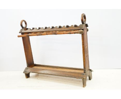 19th / early 20th century stickstand, the top with twin ring handles and eight sections for sticks having an under layer form