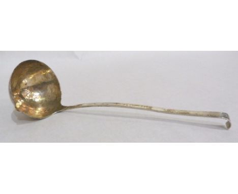 An Elizabeth II silver punch ladle with hammered bowl. London 1952. 3ozs 18dwts